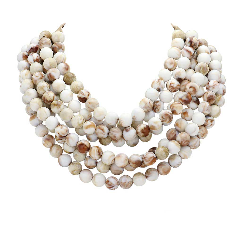 Ivory Chunky Metal Ball Beaded Multi Layered Faux Leather Magnetic Necklace, Add a bold touch to your wardrobe with this necklace. Featuring multiple strands of soft faux leather adorned with chunky metal ball beads, this statement necklace effortlessly elevates any outfit. The magnetic clasp ensures easy wear.