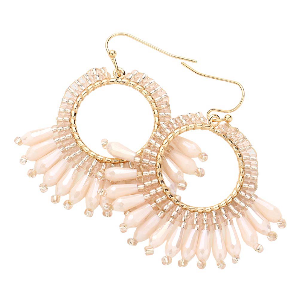 Ivory Faceted Beaded Dangle Earrings, will add a touch of subtle sparkle to your outfit. Crafted with a modern and eye-catching design, these earrings feature a faceted bead, a tiered circle, and a dangle pattern for a unique and stylish look. Perfect for either a special occasion or everyday wear.