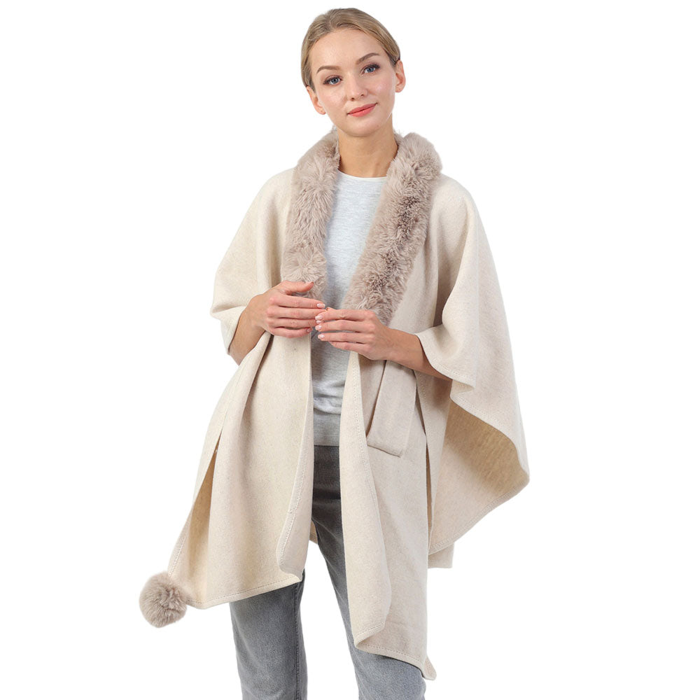 Ivory Faux Fur Collar Pom Pom Poncho, with the latest trend in ladies' outfit cover-up! The high-quality knit poncho is soft, comfortable, and warm but lightweight. It's perfect for your daily, casual, party, evening, vacation, and other special events outfits. A fantastic gift for your friends or family.