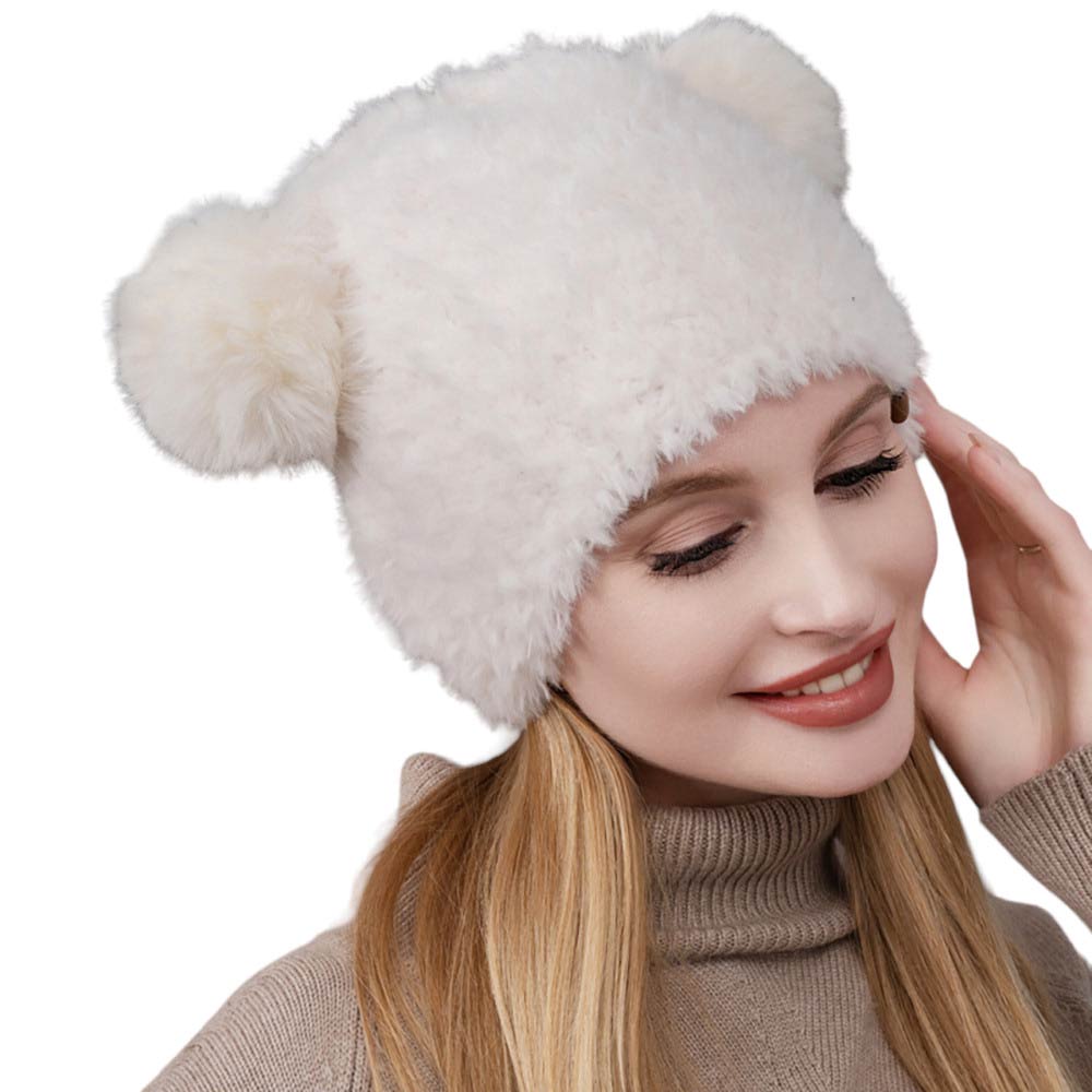 Ivory Faux Fur Pom Pom Ear Beanie Hat, stay warm in style with this comfy beanie hat. Crafted with high-quality faux fur, this piece offers maximum insulation and a fashionable look. This is the perfect hat for any stylish outfit or winter dress. Perfect gift for Birthdays, Christmas, holidays etc. to your friends, family.