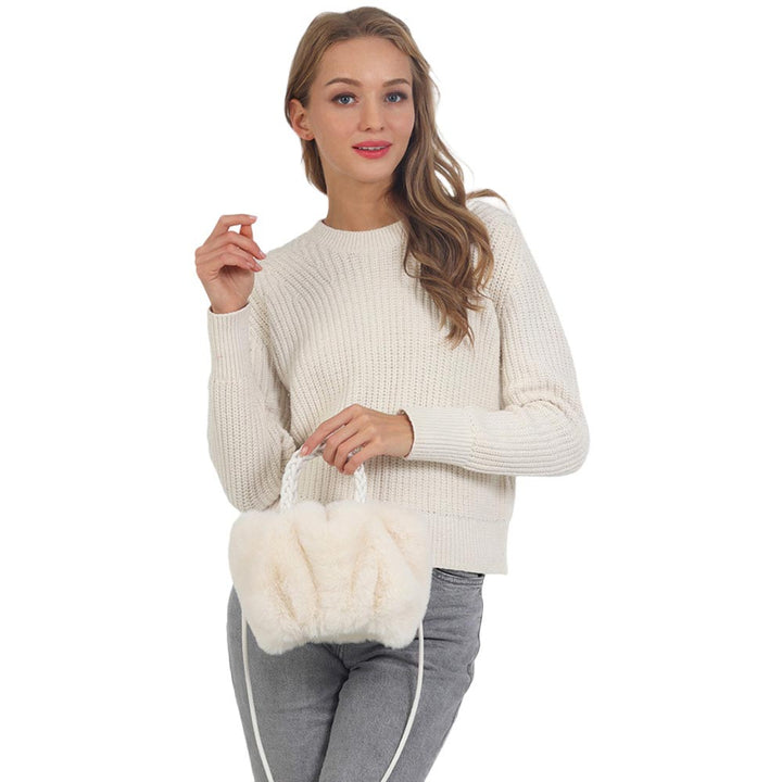 Ivory Faux Fur Tote Crossbody Bag, is perfect to carry all your handy items with ease. This faux fur tote bag features a top zipper closure for security that makes your life easier and trendier. It's very easy to carry with your hands. This is the perfect gift idea for a holiday, Christmas, anniversary, Valentine's Day, etc.