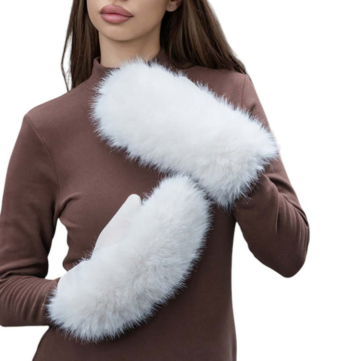 Ivory-Faux Fuzzy Fur Mitten Gloves offer warmth and style in one. Made with soft, faux fur material, they are perfect for keeping your hands cozy during the colder months. With their unique mitten design, they provide added protection and functionality. Stay fashion-forward and comfortable with these must-have gloves.