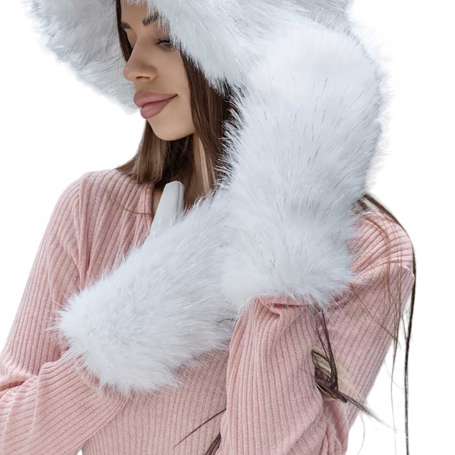 Ivory-Faux Fuzzy Fur Mitten Gloves offer the ultimate combination of style and warmth. Made with soft and luxurious faux fur, they provide maximum comfort for your hands while adding a touch of elegance to any outfit. With these gloves, you can stay cozy and fashionable all winter long.