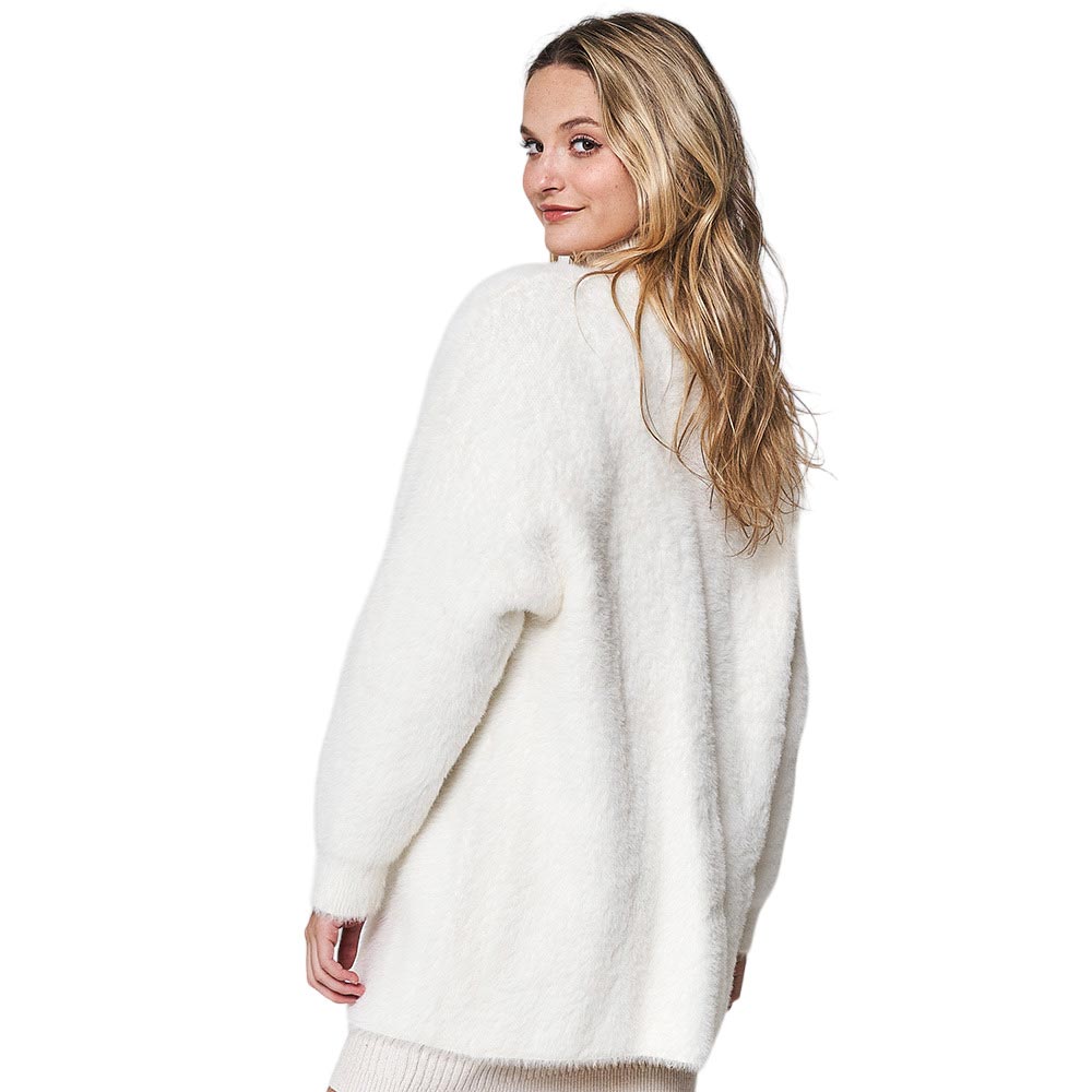 Ivory Fuzzy Open Front Knit Cardigan, is a perfect way to keep warm and stylish. Crafted with soft and cozy fabric, it offers plenty of warmth, comfort, and a versatile look. Its open front drapes beautifully to create a flattering fit, while its long-sleeve design offers protection against the elements.