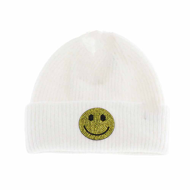 Ivory KIDS Rhinestone Smiley Face Cuff C.C Beanie is expertly crafted to provide warmth and style for young wearers. Made from a soft knit fabric, it features a cuff adorned with a rhinestone smiley face, offering a playful yet refined look. It's a snug fit that ensures comfort during colder weather while adding a cheerful and trendy touch to any child's outfit. 