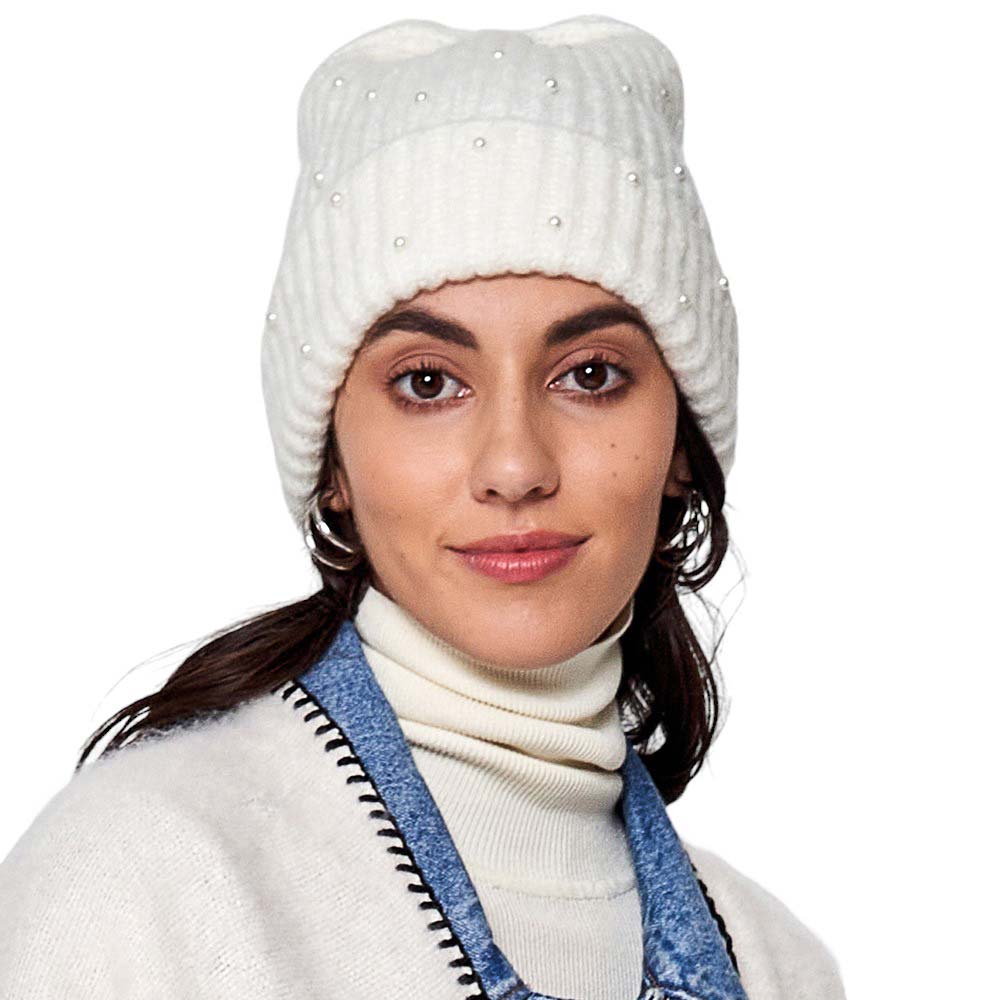 Ivory Knitted Pearl Beanie Hat, Stay warm in perfect style. This beanie is knitted with lightweight wool and features delicate pearl detailing for an effortless chic look. The lightweight wool helps to keep in warmth and is sure to be durable, keeping you warm for years to come. Nice and thoughtful gift idea in Cold Ace.