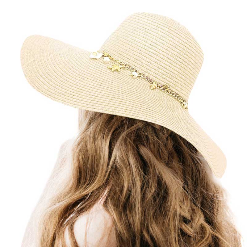 Ivory Pearl Starfish Shell Charm Band Pointed Straw Sun Hat, is perfect for any beach or outdoor occasion. The beautifully crafted pearl and shell band adds a touch of glamour, while the pointed straw design provides ample shade and breathability. Stay stylish and protected from the sun with this must-have accessory. 