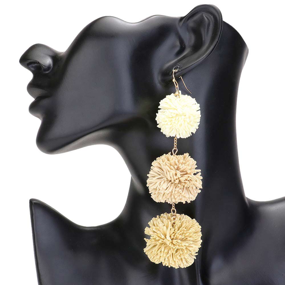 Light Pink Raffia Pom Pom Link Dropdown Earrings, These unique earrings combine the natural texture of raffia with playful pom poms to add a touch of whimsy to any outfit. The link design gives them a modern, chic feel while the dropdown style elongates the neck. Elevate your style with these statement earrings.