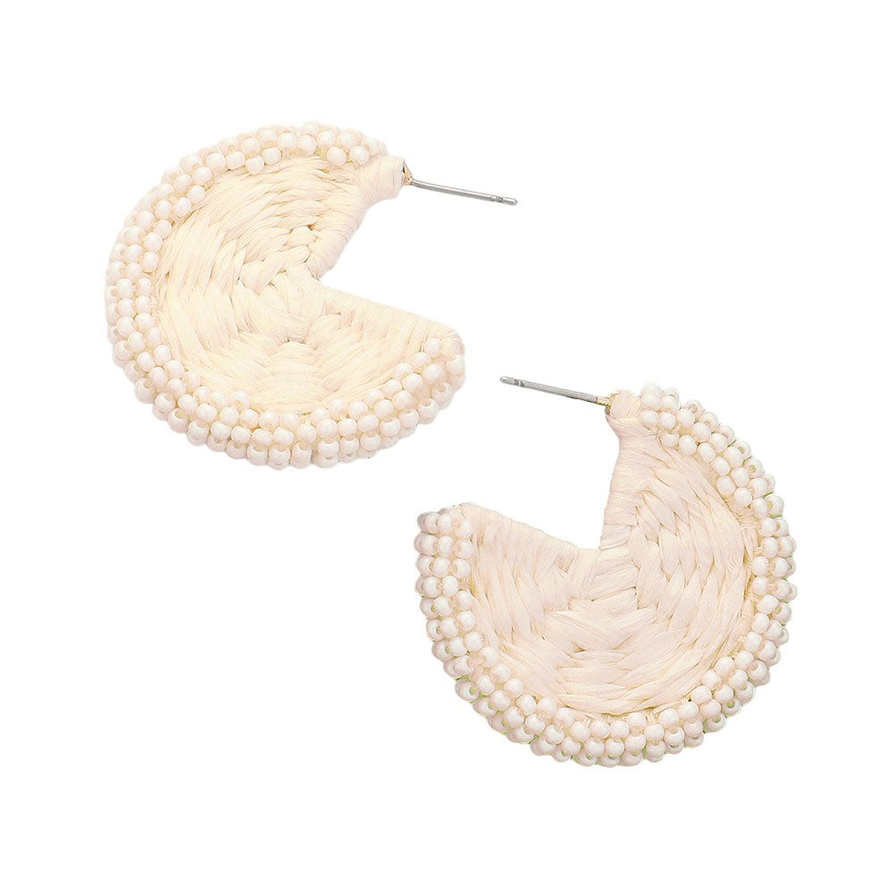 Ivory Raffia Wrapped Seed Beaded Round Earrings, Expertly crafted with a combination of raffia and seed beads, these round earrings add a touch of natural elegance to any outfit. The intricate beadwork and unique wrapping technique showcase expert artistry. Elevate your style with these earrings, perfect for any occasion.