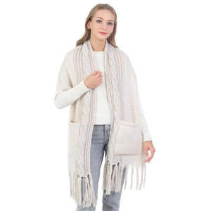 Ivory Solid Knit Pockets Tassel Oblong Scarf, is delicate, warm, on-trend & fabulous, and a luxe addition to any cold-weather ensemble. Great for daily wear in the cold winter to protect you against the chill, the classic style scarf & amps up the glamour with a plush material. Perfect gift for birthdays, or any occasion.