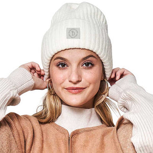 Ivory Solid Knitted Beanie Hat, is crafted with a soft Acrylic material, making it lightweight and comfortable. Its ribbed-knit construction delivers warmth and protection in cool weather. Its one-size-fits-all design makes it a great gift choice for men, women, or children.