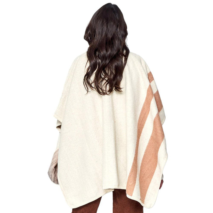 Ivory Striped Button Closure Cape Ruana Poncho, effortlessly combines style and function. Crafted with pure polyester, this poncho is designed with a bold striped pattern and a button closure, making it the perfect piece to transition from day to night. Versatile and stylish, this poncho will become a go-to in your wardrobe.