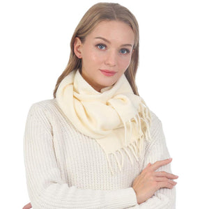 Ivory Trendy Solid Fringe Oblong Scarf, is delicate, warm, on-trend & fabulous, and a luxe addition to any cold-weather ensemble. Great for daily wear in the cold winter to protect you against the chill, the classic style scarf & amps up the glamour with a plush. Perfect gift for birthdays, holidays, or any occasion.