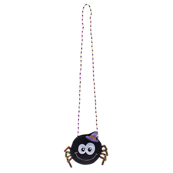 Halloween Spider Beaded Mini Crossbody Bag Effortlessly accessorize your Halloween costume with our beautifully handcrafted Crossbody Bag. Made with intricate beadwork and a convenient crossbody design, this bag adds a touch of spooky elegance to any outfit. Perfect for storing your essentials while trick-or-treating.