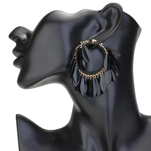 Jet Black Sequin Fringe Hoop Pin Catch Earrings add a touch of glamour to any outfit. The hoop design features cascading sequins for a chic and trendy look. The pin catch style ensures they will stay securely in place, making them perfect for a night out or special occasion. Ideal gift for any fashion forward individual.