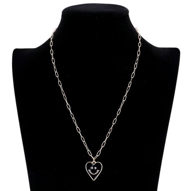 Jet Black Smile Pointed Enamel Heart Pendant Necklace is expertly crafted to showcase its unique design. The pointed enamel heart adds a playful touch to any outfit. Made with high-quality materials, this necklace is durable and will remain a timeless piece in your jewellery collection.