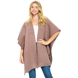 Khaki Bling Solid Ruana Poncho is a fashionable outfit. Crafted with a soft, luxurious  blend of 50% viscose, 25% nylon, and 25% polyester, this poncho provides a superior level of comfort and warmth. The one size fits all construction adds to its versatility. An essential piece for your wardrobe for winter season.