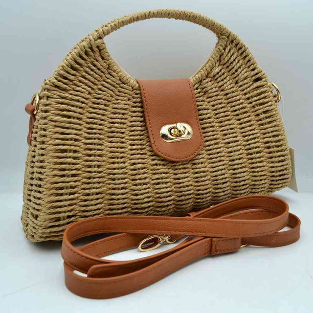 Khaki Elevate your summer wardrobe with this essential, chic straw handbag. Perfectly balancing bohemian charm with modern elegance, this bag is designed to transition effortlessly from casual beach outings to refined evening brunch dates.