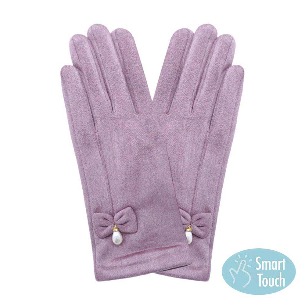 Lavender Bow Pearl Dangle Pointed Faux Suede Smart Touch Gloves, these smart gloves designed for both stylish and practical use. With a smart touch feature, these gloves allow easy use of touchscreen devices. The faux suede material keeps your hands warm and comfortable, while the bow and pearl dangle add a touch of elegance.