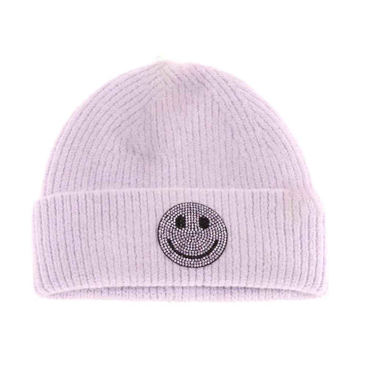 Lavender KIDS Rhinestone Smiley Face Cuff C.C Beanie is expertly crafted to provide warmth and style for young wearers. Made from a soft knit fabric, it features a cuff adorned with a rhinestone smiley face, offering a playful yet refined look. It's a snug fit that ensures comfort during colder weather while adding a cheerful and trendy touch to any child's outfit. 