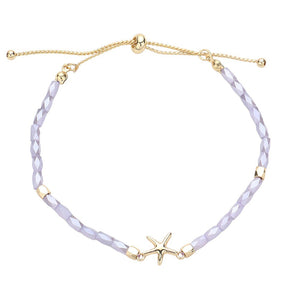 Lavender Metal Starfish Pointed Faceted Beaded Pull Tie Cinch Bracelet! Perfect for any occasion, this bracelet features a stunning metal starfish charm and intricately faceted beads that add a touch of elegance and style. Elevate your look and make a statement with this unique and versatile bracelet.