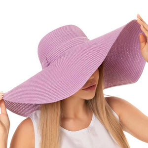 Lavender Solid Floppy Straw Sun Hat, Stay stylish and protected from the sun with our sun hats! Made from high-quality straw, this hat is perfect for any sunny day. Its floppy design not only looks fashionable but also provides ample shade for your face and neck. Don't forget to pack this accessory for your next beach trip!