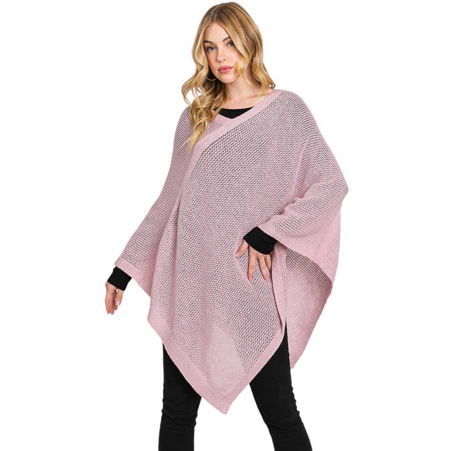 Lavender Solid Knit Loose Fit Poncho, Crafted from a comforting, arctic wool blend fabric, features a loose-fitting design that will keep you cozy without compromising on style. Perfect for day-to-day wear. Look stylish and stay warm in this stylish poncho. It can be a stylish gift to family members or fashion loving friends.