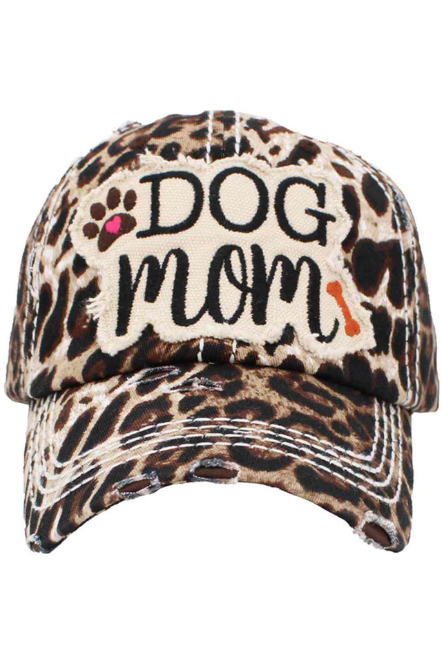 Leopard DOG MOM Vintage Distressed Baseball Cap Show your love for your furry best friend with this charming vintage-style baseball cap. Featuring a distressed leopard print design and bold "DOG MOM" embroidery, it's the perfect accessory for dog lovers everywhere. Crafted from 100% cotton for breathable comfort and durability. The classic one-size-fits-most design ensures a comfortable fit for most wearers.