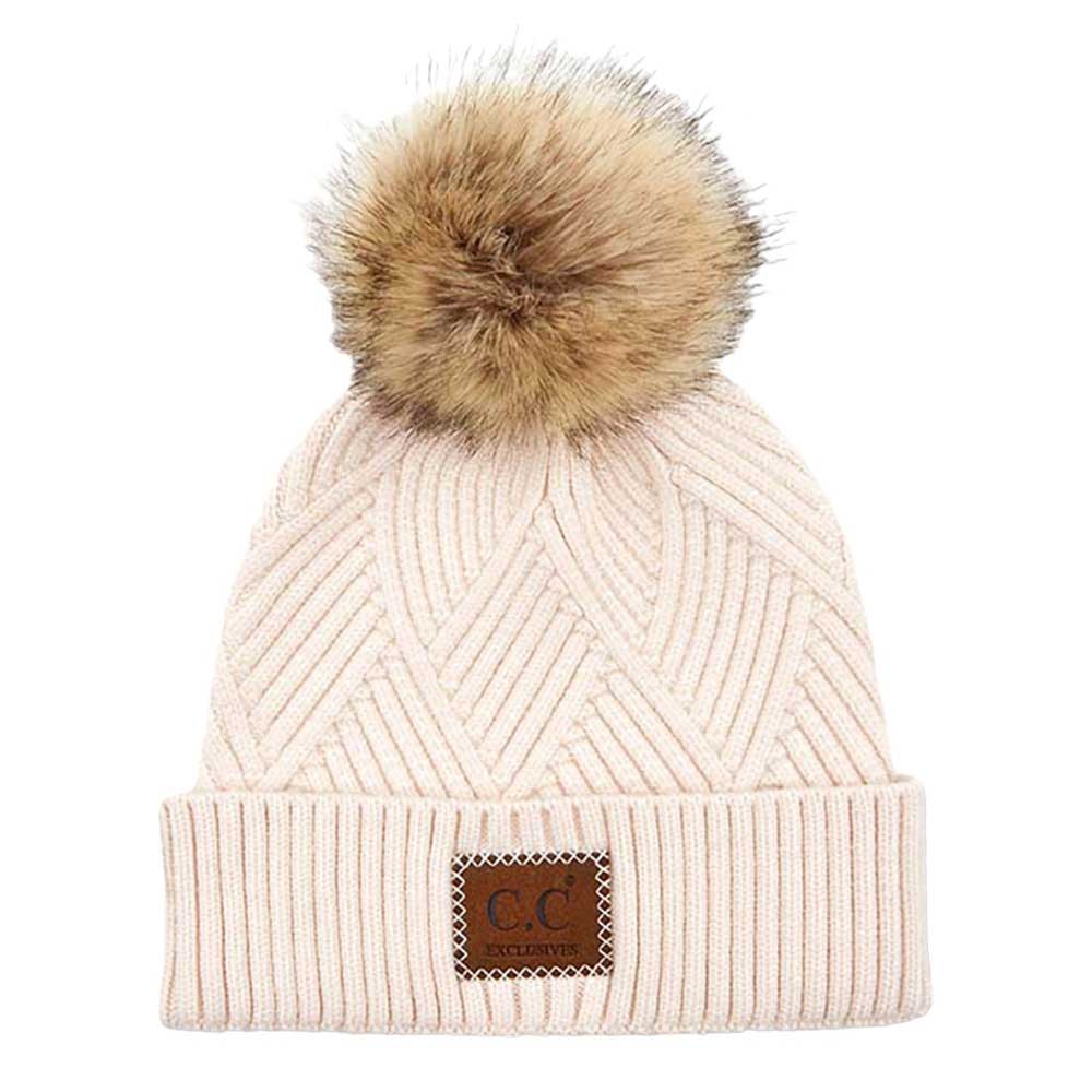 Light Beige C.C Heather Beanie Hat With Pom Pom And Suede Patch, provides excellent protection and a fashionable look with its soft heather knit material, faux fur pom pom, and stylish suede patch. The fabric is designed to keep you comfortably warm in cold weather. Add this fashionable accessory to the winter wardrobe collection.
