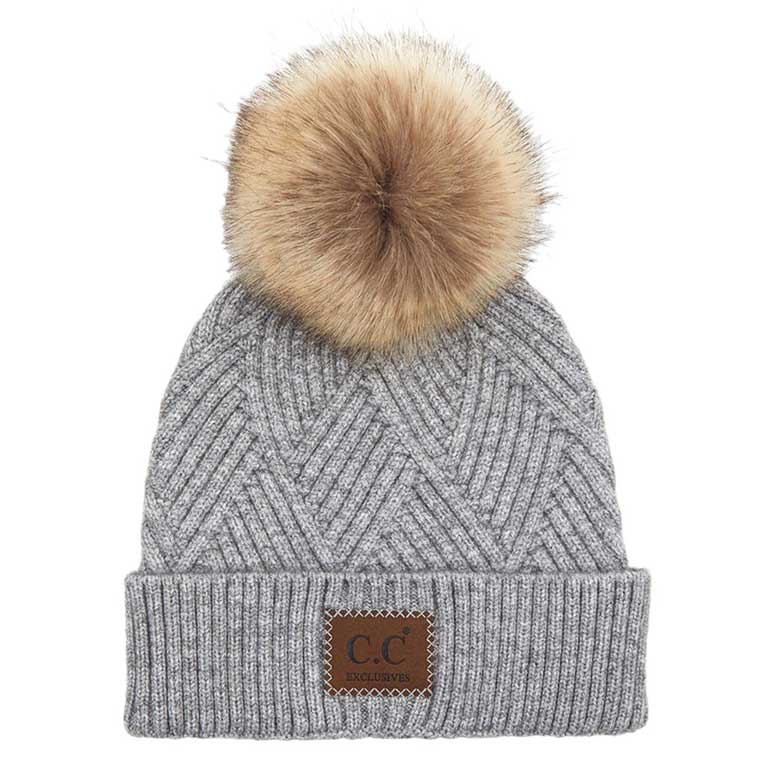 Light Gray C.C Heather Beanie Hat With Pom Pom And Suede Patch, provides excellent protection and a fashionable look with its soft heather knit material, faux fur pom pom, and stylish suede patch. The fabric is designed to keep you comfortably warm in cold weather. Add this fashionable accessory to the winter wardrobe collection.