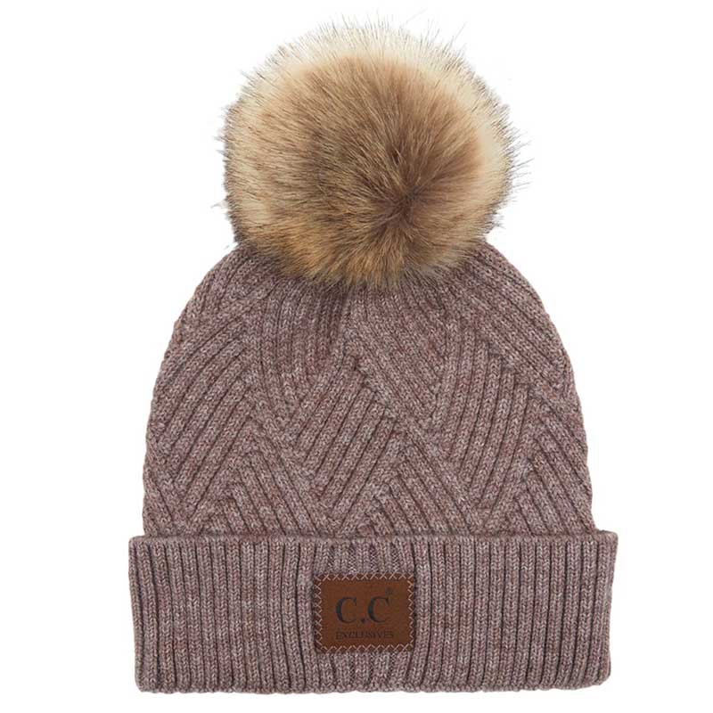 Light Taupe C.C Heather Beanie Hat With Pom Pom And Suede Patch, provides excellent protection and a fashionable look with its soft heather knit material, faux fur pom pom, and stylish suede patch. The fabric is designed to keep you comfortably warm in cold weather. Add this fashionable accessory to the winter wardrobe collection.