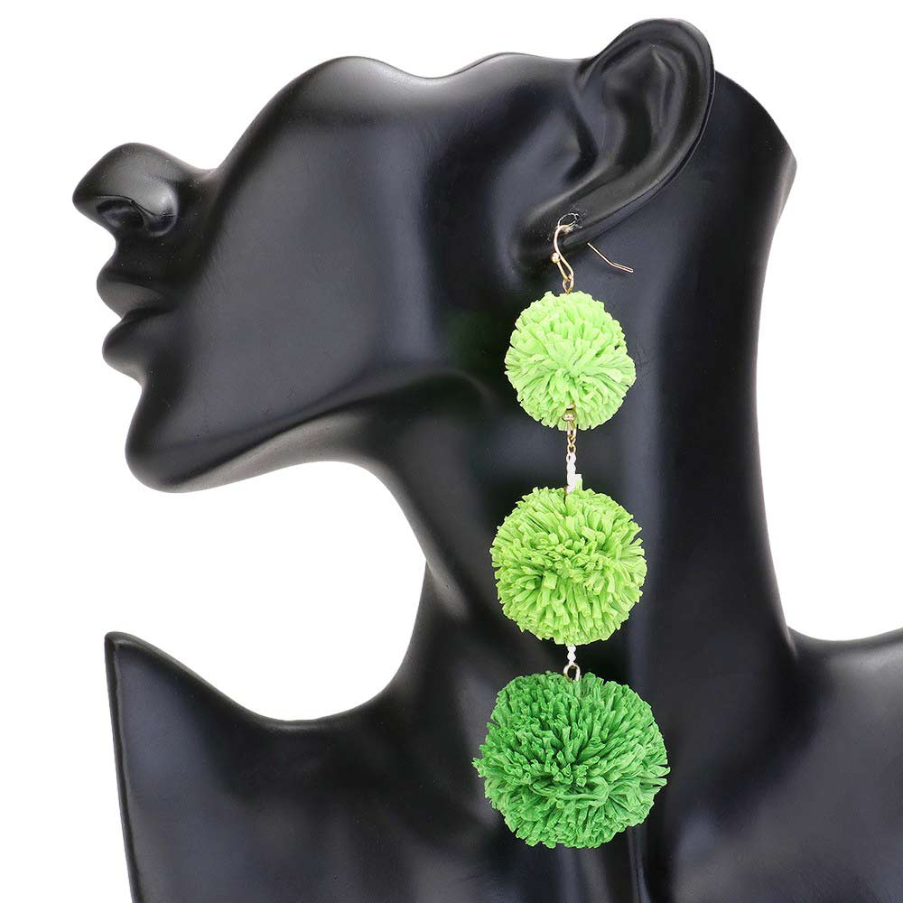 Lime Raffia Pom Pom Link Dropdown Earrings, These unique earrings combine the natural texture of raffia with playful pom poms to add a touch of whimsy to any outfit. The link design gives them a modern, chic feel while the dropdown style elongates the neck. Elevate your style with these statement earrings.