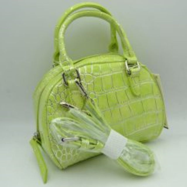 Lime This stylish dome satchel features a structured silhouette w/ a distinct embossed tile-like pattern, making it an excellent accessory for everyday use. Designed w/ a secure top zipper closure equipped w/ an extended pull tab, it opens to a main compartment perfect for keeping daily essentials protected. Dual rolled top handles offer a comfortable grip for handheld carrying, while an included detachable shoulder strap connects easily w/ metallic clasps to provide versatile hands-free carrying options.