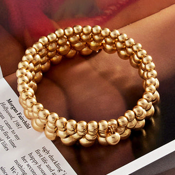 Madeline Love Worn Gold Metal Ball Cluster Coil Bracelet - Bracelets