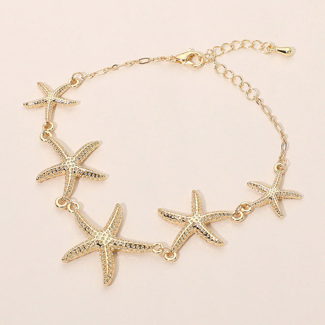 Madeline Love Gold Textured Metal Starfish Link Bracelet