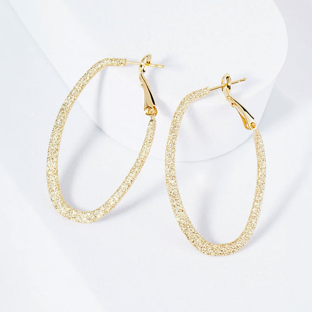 Madeline Love Gold Gold Plated Hypoallergenic Textured Oval Hoop Earrings