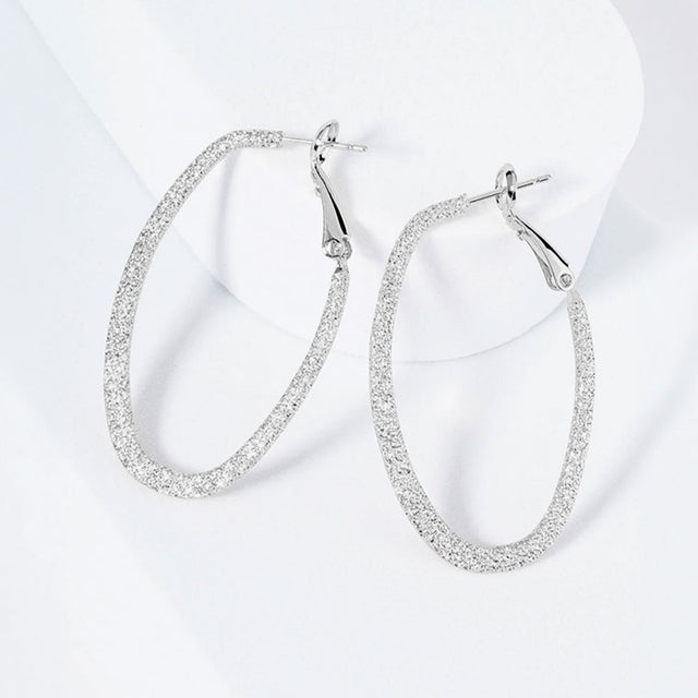 Madeline Love Rhodium Rhodium Plated Hypoallergenic Textured Oval Hoop Earrings