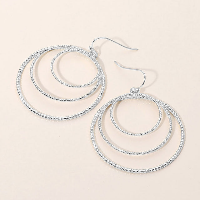 Madeline Love Silver Textured Metal Triple Layered Hoop Dangle Earrings