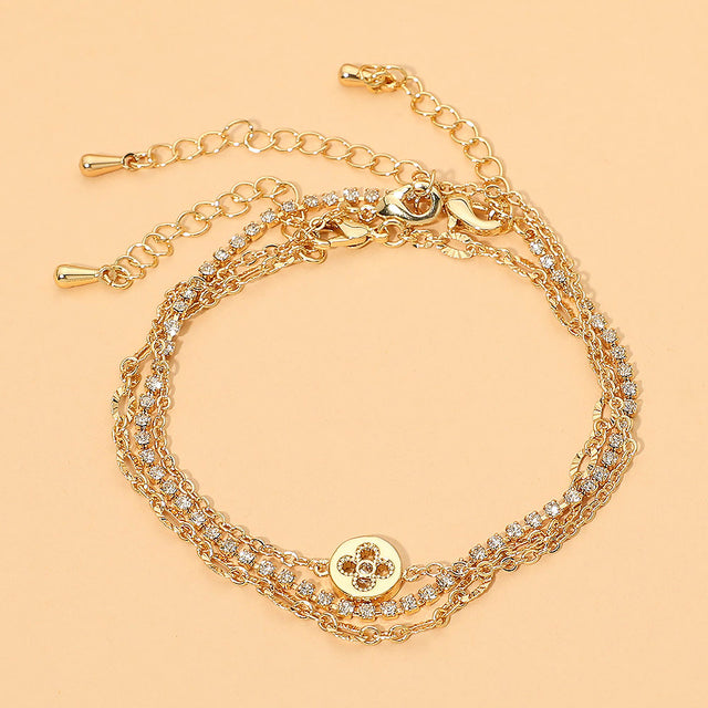 Madeline Love Clear, Gold Quatrefoil Charm Accent Dainty Textured Tennis Chain Multi Layered Bracelets