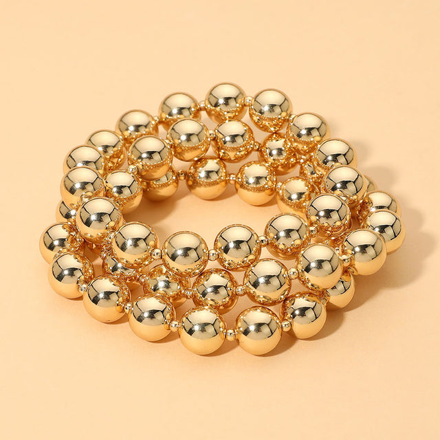 Madeline Love Gold Metal Ball Beaded Stretch Multi Layered Bracelets