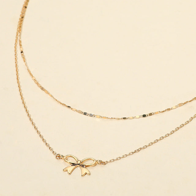 Madeline Love Gold Metal Bow Pendant Accent Layered Chain Necklace - Necklaces