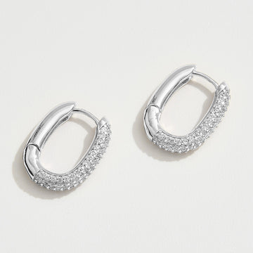 Madeline Love Silver White Gold Dipped CZ Stone Paved Oval Huggie Hoop Earrings