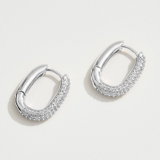 Madeline Love Silver White Gold Dipped CZ Stone Paved Oval Huggie Hoop Earrings