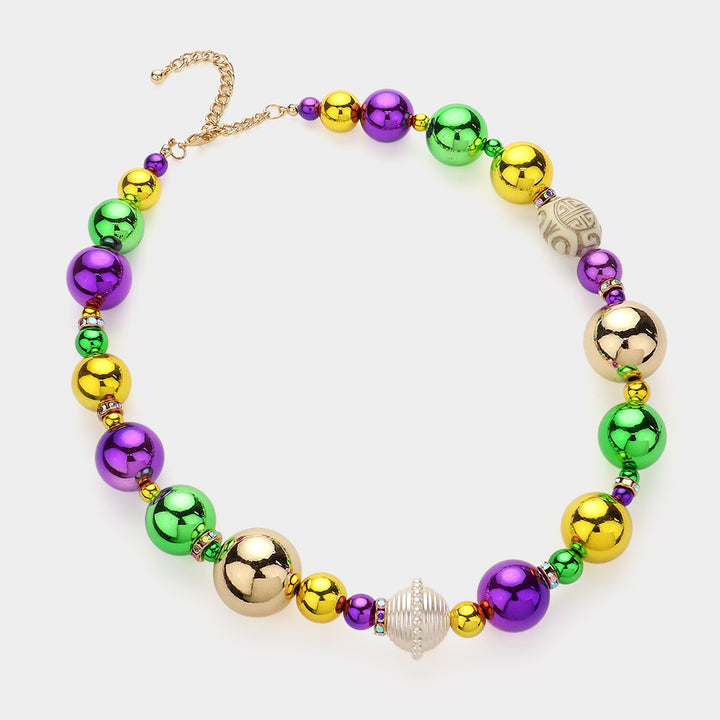 Mardi Gras Ball Beaded Necklace is the perfect accessory for your next carnival celebration. The vibrant colors and intricate beading make it a standout piece that will catch everyone’s eye. Crafted with high-quality materials, it’s both durable and long-lasting. Add a festive flair to your outfit with this striking Mardi Gras necklace.