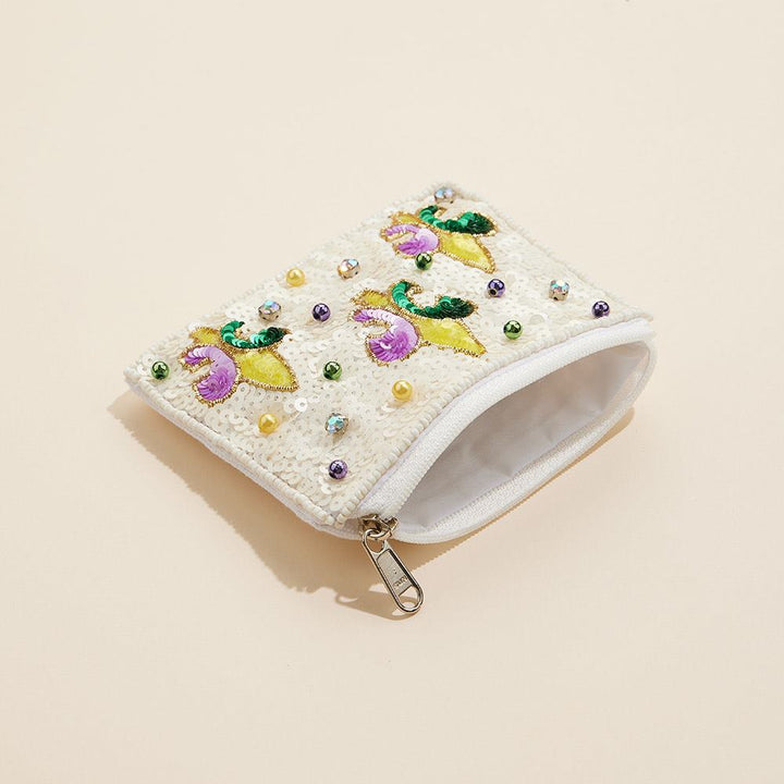 Mardi Gras Fleur de Lis Sequin Stone Pearl Ball Seed Beaded Mini Pouch Bag is a festive and stylish addition to any accessories collection. Crafted with intricate detailing, it adds a touch of elegance to any outfit. Its compact size makes it ideal for carrying essential items on the go.