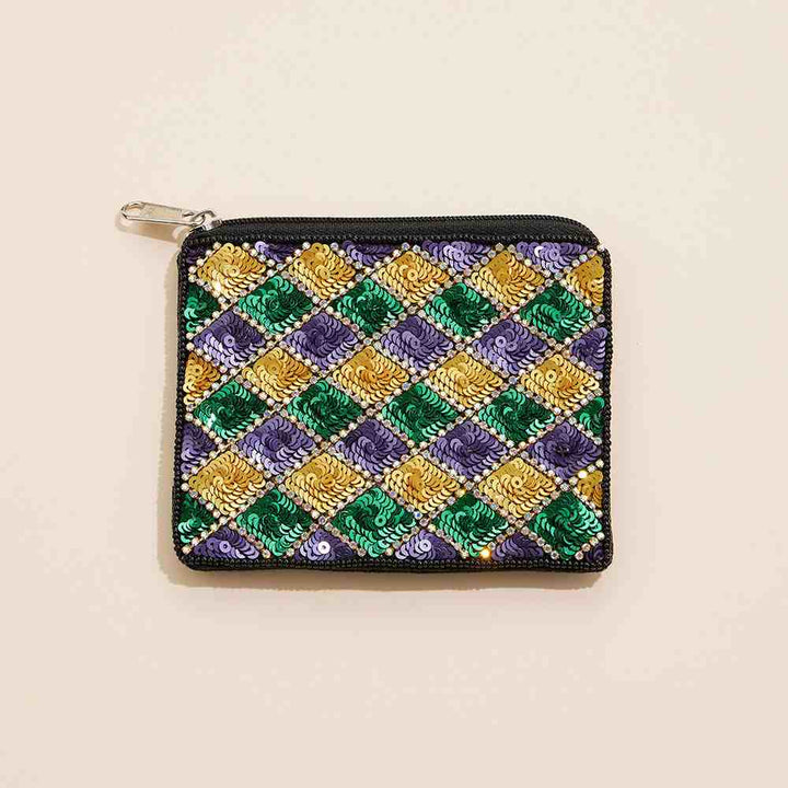 Mardi Gras Sequin Stone Beaded Mini Pouch Bag is a stylish and festive accessory for any occasion. Intricate sequin and stone beading add a touch of flair, while the compact size makes it ideal for carrying essentials on the go. Elevate your outfit and celebrate in style with this mini pouch bag.