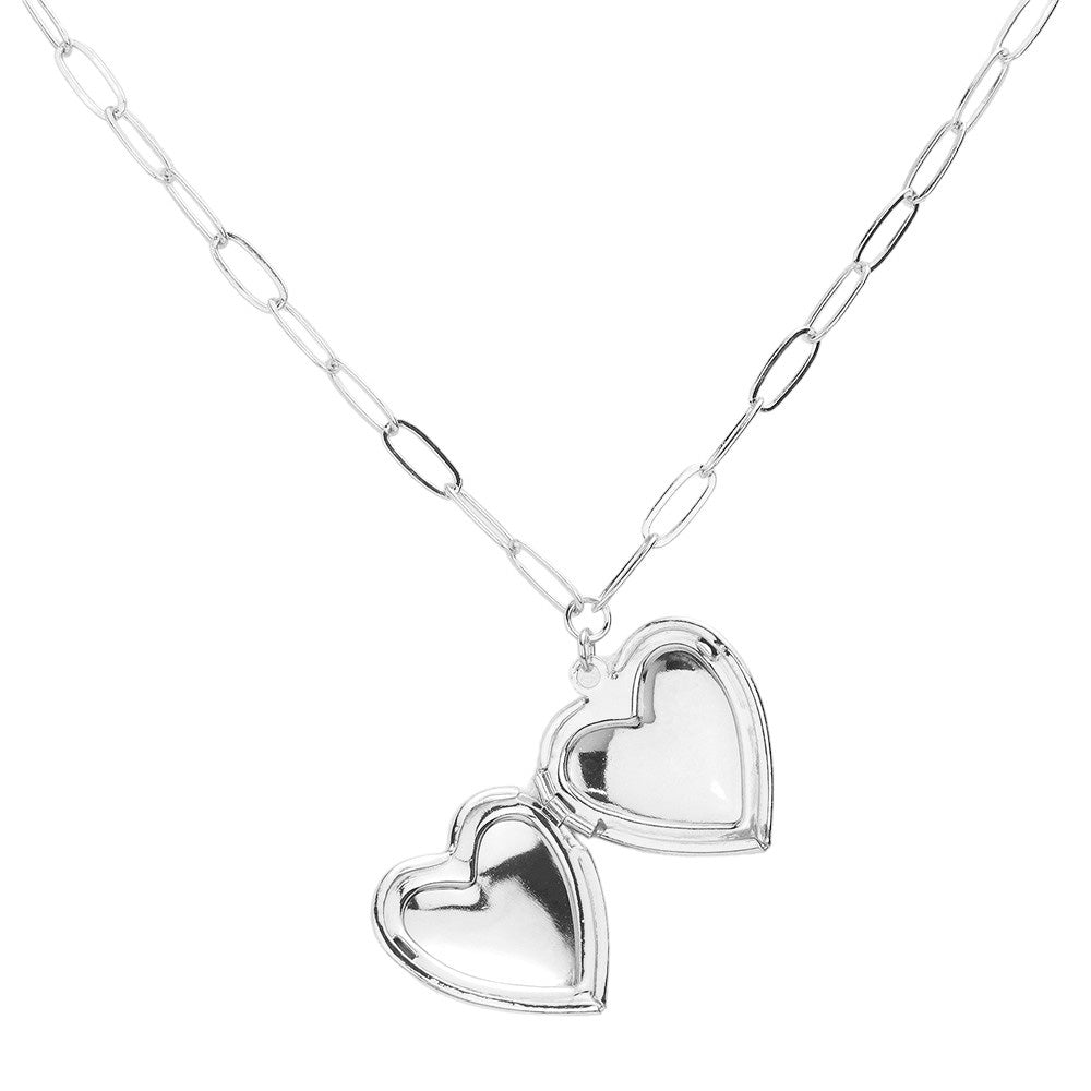 Matte Metal Heart Locket Pendant Paperclip Chain Necklace. This elegant necklace features a matte metal heart locket pendant suspended from a delicate paperclip chain. The unique combination of materials and design adds a modern touch to this classic accessory. Perfect for keeping your loved ones close to your heart.