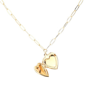 This fashionable necklace features a matte metal heart locket pendant and a paperclip chain. The heart locket allows you to store a sentimental photo or small keepsake. The on-trend paperclip chain adds a unique touch to any outfit. Matte Finish Pendant Necklace. Heart Locket Paperclip Link. Matte Metal Heart Locket.