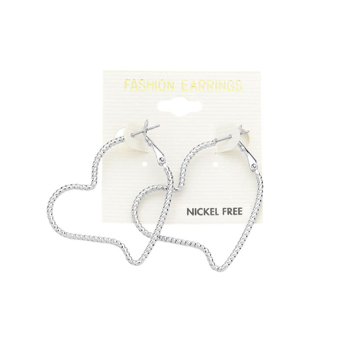 Metal Heart Hoop Earrings are a stylish addition to any outfit. Made of a durable metal, they are solid and long-lasting. With their heart-shaped design, they add a touch of romance to any look. Perfect for a date night or a day at the office. 