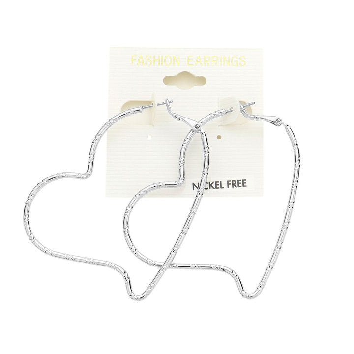 Metal Heart Hoop Earrings are crafted with high-quality metal, perfect for adding a touch of elegance to any outfit. Lightweight and comfortable to wear, these earrings feature a unique heart design that will surely catch the attention of others. Add a stylish touch to your look with these stunning earrings. 